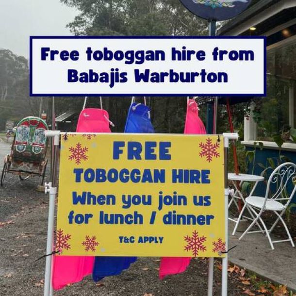 A sign says free toboggan hire at babajis warburton