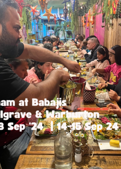 A communal table is served a traditional onam sadya on banana leaf