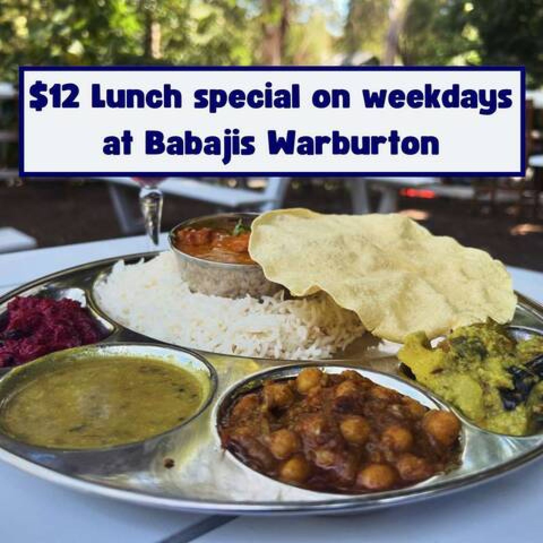 A plate of five south indian curries sits on a table overlooking the yarra river