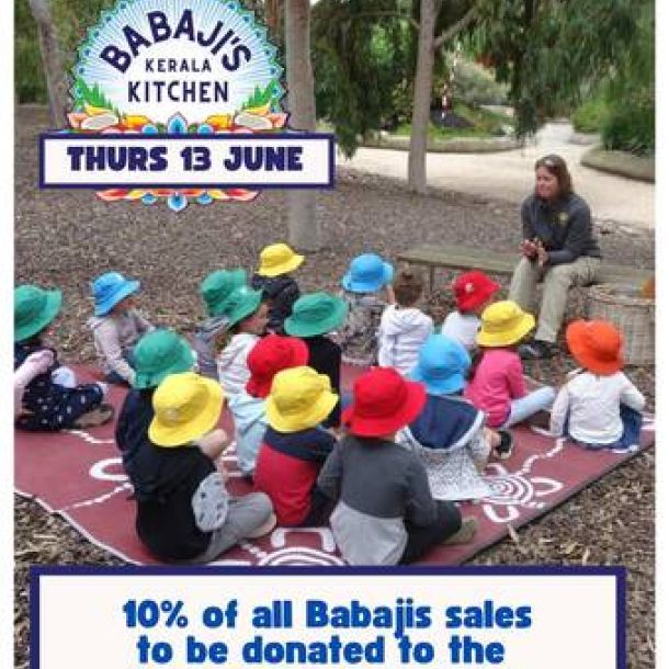 A group of Tecoma preschoolers listen to a story outside