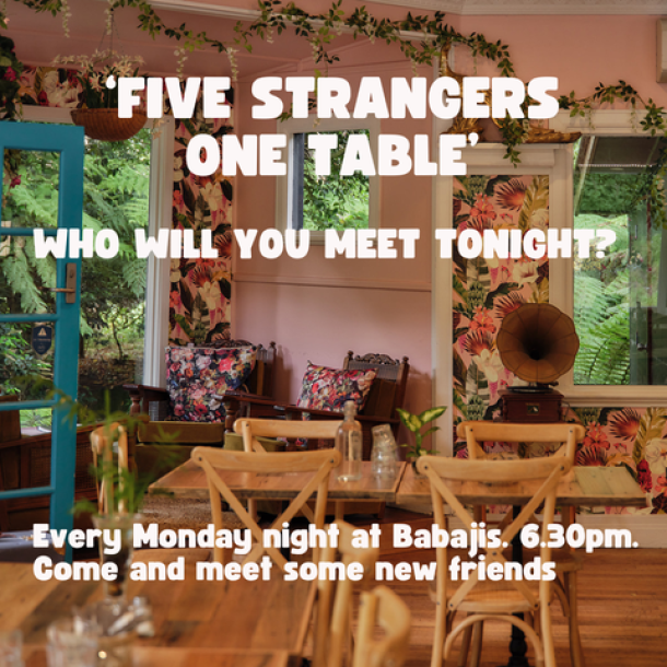 A table of five awaits five strangers soon to be friends