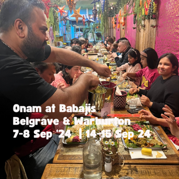 A communal table is served a traditional onam sadya on banana leaf